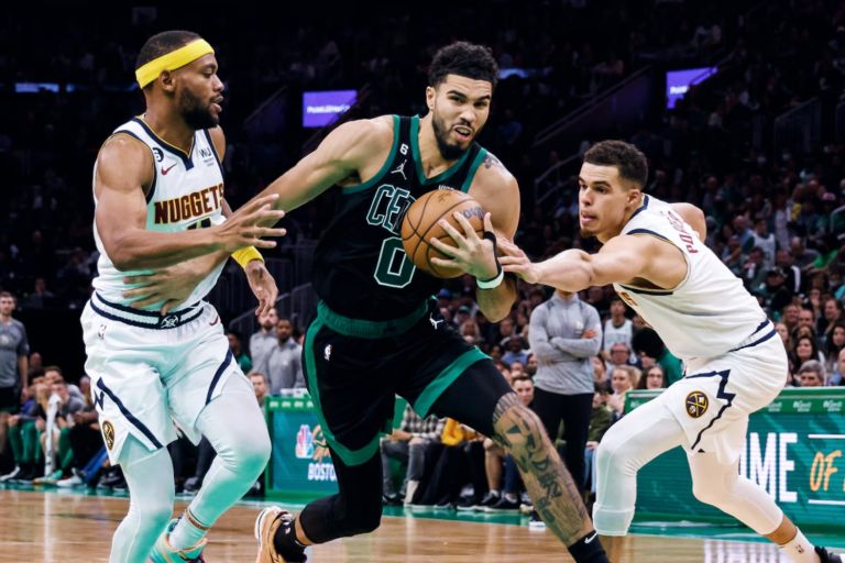 Image showing the ball in Jayson Tatum hand during the end of the match.