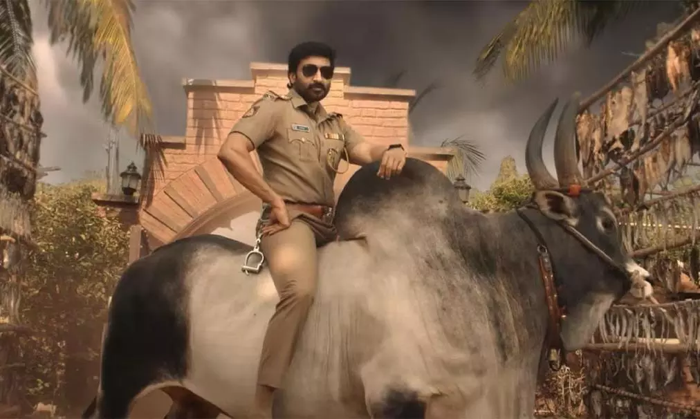 A image from Bhimaa movie showing Bhimaa (real name: Gopichand) sitting on a buffalo in a stylish pose.