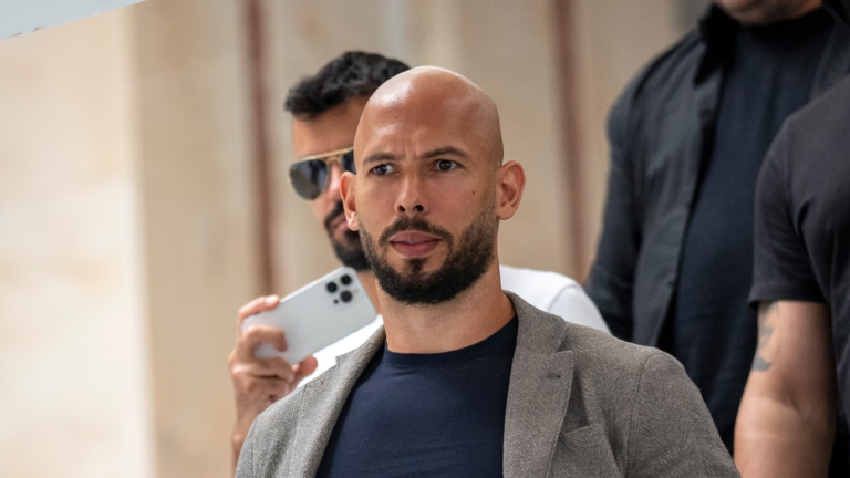 Image showing andrew tate reaction when being detained